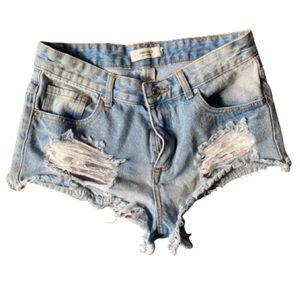 Raw hem denim shorts with fringe
